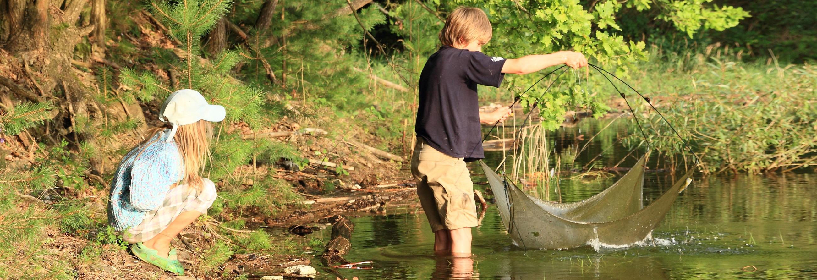 Kids having fun fishing with their Sonic Travel Trailer