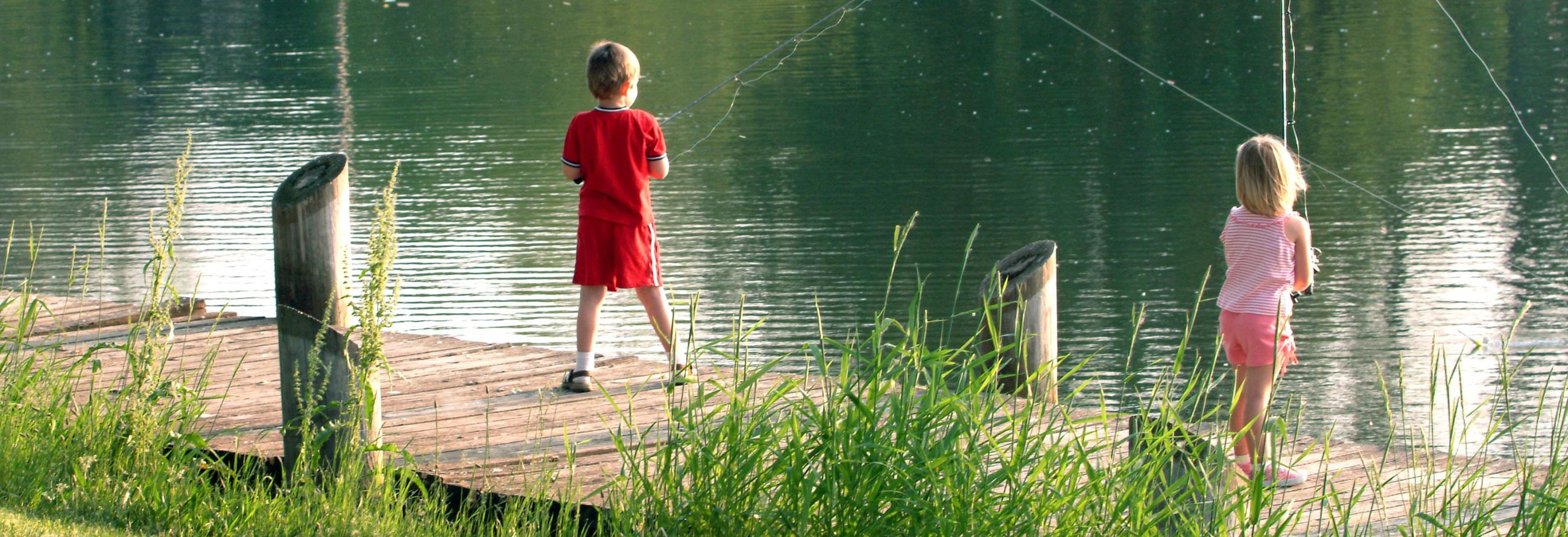 Kids enjoying fishing with their SportTrek Travel Trailer